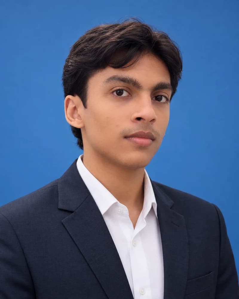 Uzair Umair in a navy suit